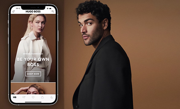 Mock-up of HUGO BOSS app next to Matteo Berrettini wearing a black suit jacket (Photo)