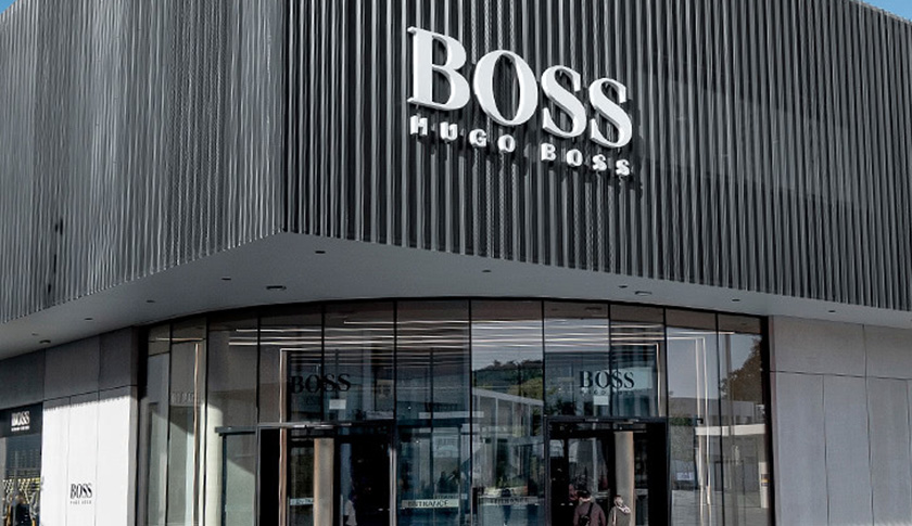 Outside of a factory outlet store with BOSS Logo (Photo)