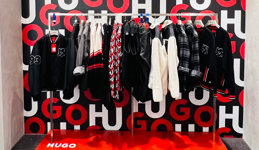 A clothes rack with HUGO items (Photo)