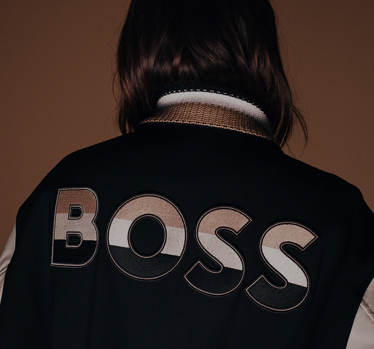 Powerful Brands – Person facing away dressed in BOSS college jacket (Photo)