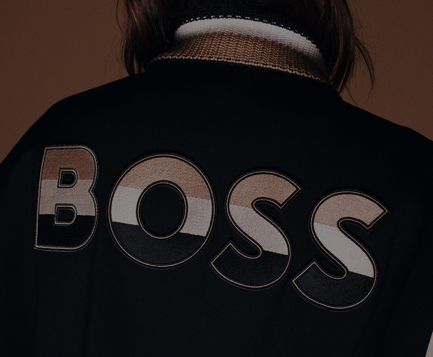 Powerful Brands – Person facing away dressed in BOSS college jacket (Photo)